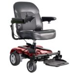 Front side view of the Merits EZ-GO / EZ-GO Deluxe wheelchair in striking red color, highlighting its vibrant hue, co...