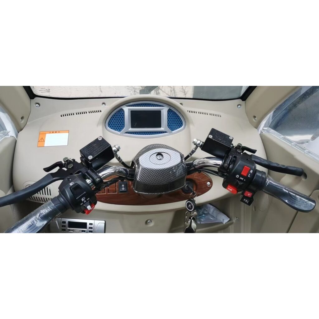 Close-up of the dashboard in a GIO Golf mobility scooter, featuring handlebars, gauges, and controls.