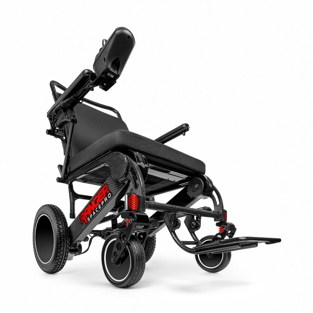 Porto Mobility Ranger SpacePro XXL folding power wheelchair with joystick armrest raised, low angled front view